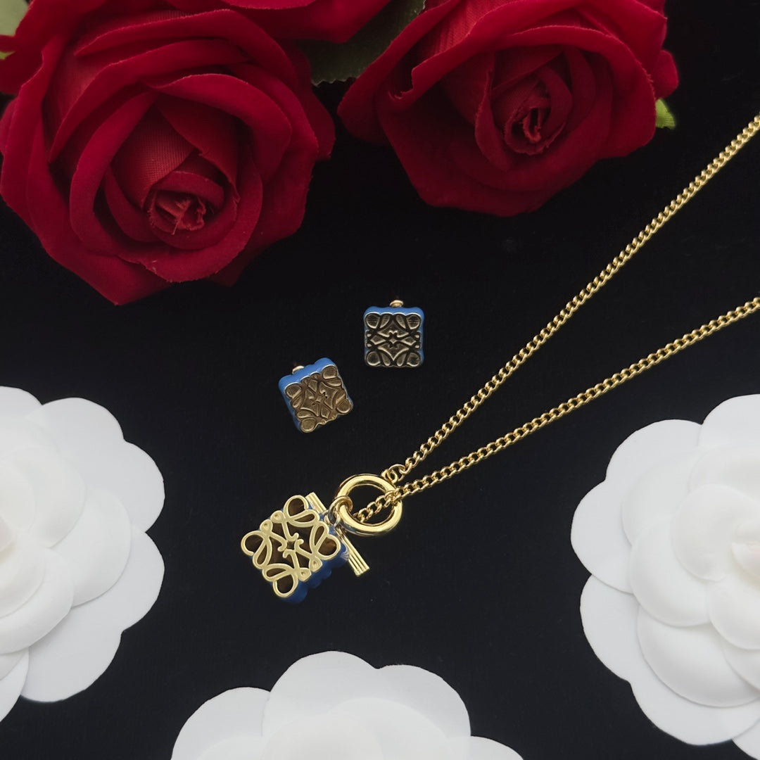 LOEWE ANAGRAM BLUE GOLD STUD EARRINGS